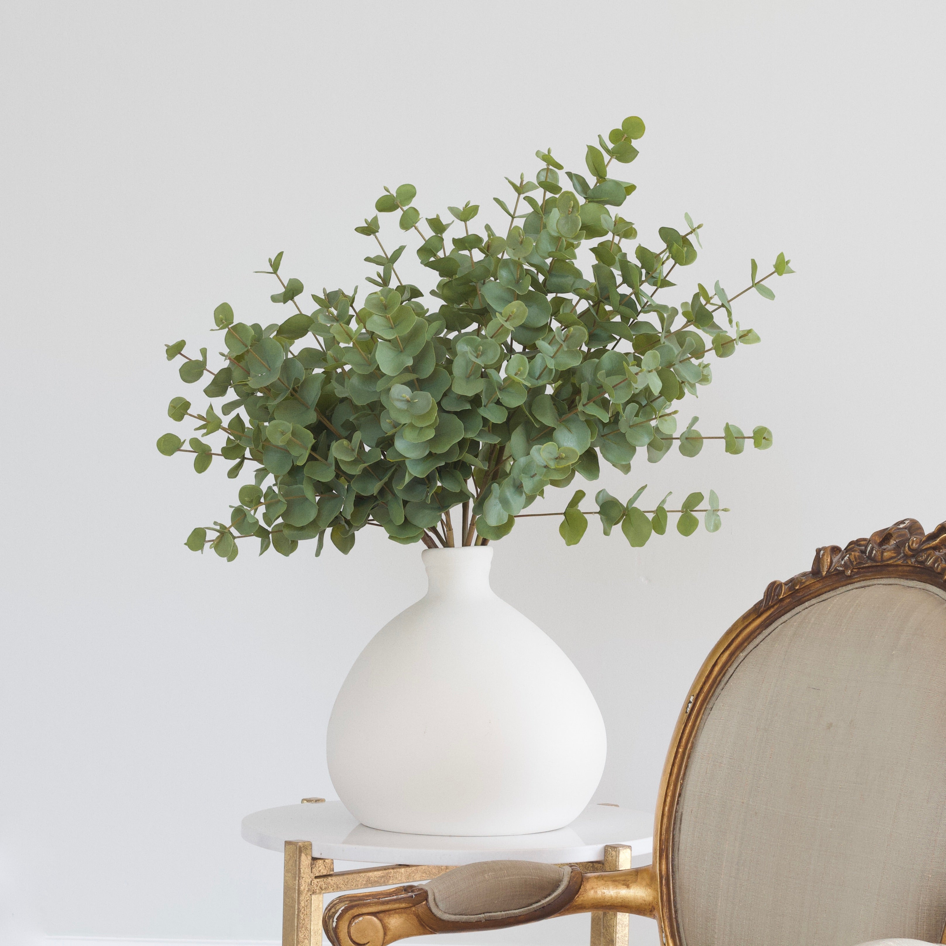 Artificial Eucalyptus - one of our most popular stems of faux foliage , looks stunning styled as a few faux eucalyptus stems or bunches of stems for a faux flower display of Faux Eucalyptus