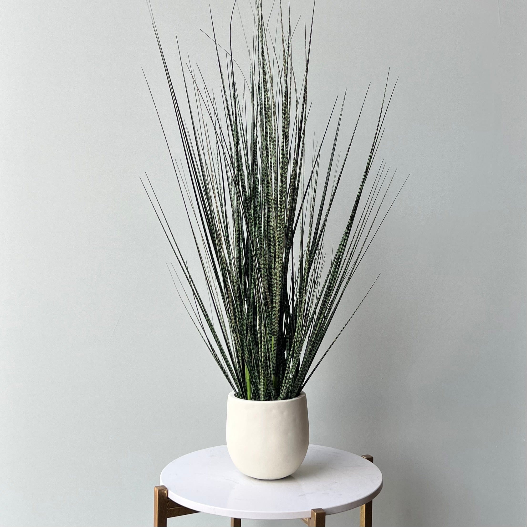 Realistic Artificial Mottled Onion Grass in Stone-look Planter AHCH-1523 by The Faux Flower Company